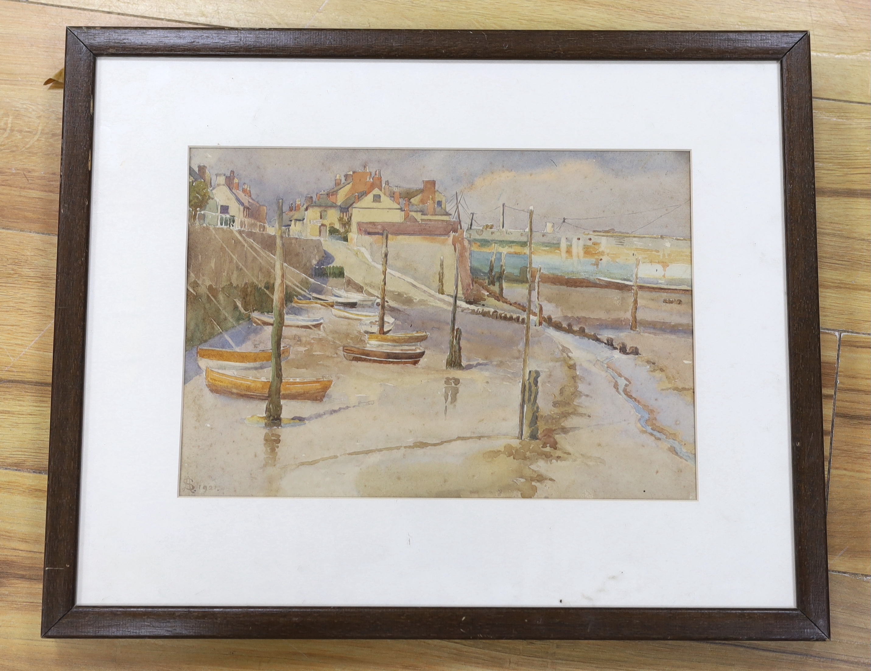 Arthur Suker (1857-1902), watercolour, Fishing village at low tide, monogrammed and dated 1921, 23 x 33cm